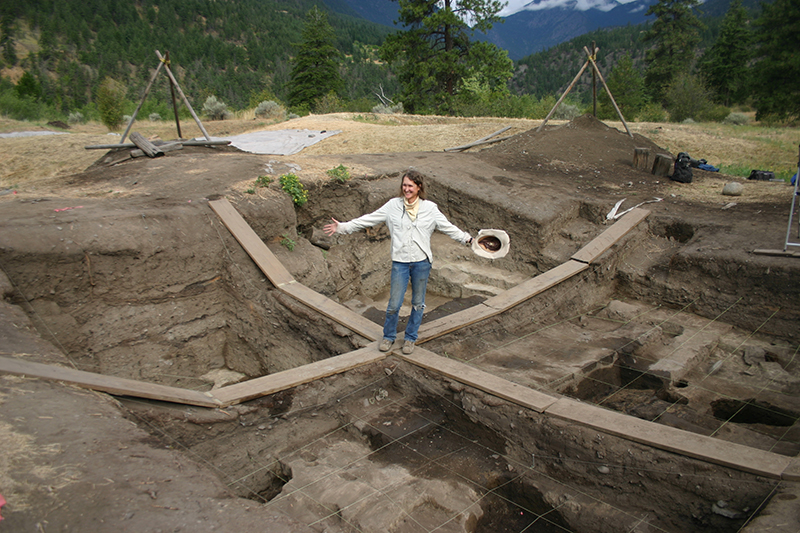 archaeologist standing in excavation