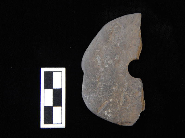 Stone (slate) spindle whorl fragment