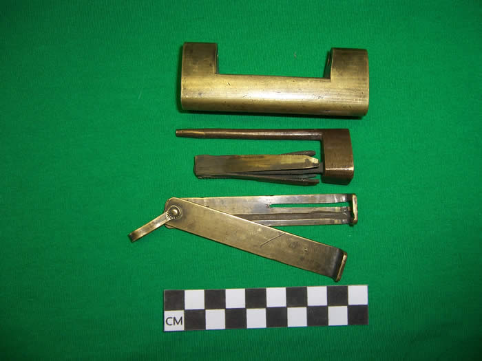 disassembled brass lock