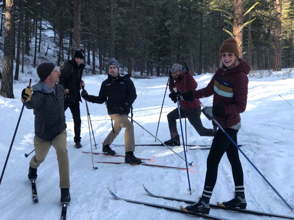 MFA students pose while cross-country skiing. 