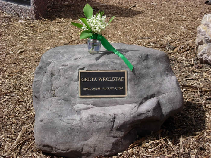 Greta Wrolstad memorial plaque on a rock
