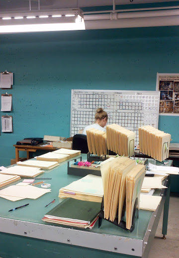 work table with student intern in the background