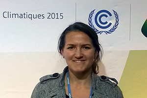 woman in front of 2015 paris climate conference